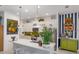Well-lit kitchen features a center island and stainless steel appliances at 2440 Pawtucket Pass, Mount Dora, FL 32757