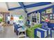 Spacious living room featuring colorful decor, bright accents, and an open floor plan at 2440 Pawtucket Pass, Mount Dora, FL 32757