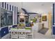 Open-concept living space seamlessly connects the dining, living, and kitchen areas at 2440 Pawtucket Pass, Mount Dora, FL 32757