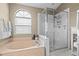Bright bathroom featuring a separate shower and tub at 2737 Cahill Way, Lake Mary, FL 32746