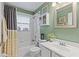 Inviting bathroom featuring a shower-tub combination and ample lighting at 2737 Cahill Way, Lake Mary, FL 32746