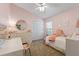 Charming bedroom with a desk and a large window at 2737 Cahill Way, Lake Mary, FL 32746