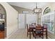 Cozy dining room features a modern chandelier and natural light at 2737 Cahill Way, Lake Mary, FL 32746