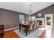 Elegant dining area with a fireplace and ample natural light at 2737 Cahill Way, Lake Mary, FL 32746