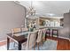 Charming dining room with an elegant chandelier and view to the kitchen at 2737 Cahill Way, Lake Mary, FL 32746