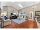 Bright living room with a vaulted ceiling and hardwood floors at 2737 Cahill Way, Lake Mary, FL 32746