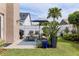 Inviting outdoor patio with comfortable seating, stylish rug, and a well-manicured lawn creating a perfect relaxation space at 2737 Cahill Way, Lake Mary, FL 32746