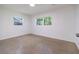 Bright bedroom with windows and neutral walls at 3141 Cashmere Dr, Orlando, FL 32827