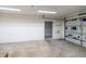 Spacious garage area featuring a partially open door, and room for storage or parking at 3141 Cashmere Dr, Orlando, FL 32827