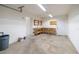 Garage features a utility sink, workbench, and shelving for projects and storage solutions at 3141 Cashmere Dr, Orlando, FL 32827