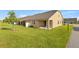 Nice backyard featuring a well-maintained lawn and covered patio accessible through sliding glass doors at 3279 Canna Lily Pl, Clermont, FL 34711
