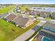 Aerial image displays a spacious backyard with lush green grass and lovely lawn, perfect for outdoor activities at 3279 Canna Lily Pl, Clermont, FL 34711
