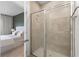 Modern bathroom features a glass enclosed shower at 3279 Canna Lily Pl, Clermont, FL 34711