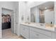 Elegant main bathroom with double vanity, and walk-in shower at 3279 Canna Lily Pl, Clermont, FL 34711