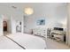 Bright main bedroom with television, decorative chandelier and walk-in closet at 3279 Canna Lily Pl, Clermont, FL 34711