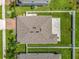 Aerial view of a property showing a well-maintained lawn, brick driveway, patio, and privacy fence at 3849 Kimbolton Way, Sanford, FL 32773