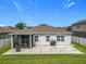 Backyard with a patio, grill, green grass, and a screened-in porch at 3849 Kimbolton Way, Sanford, FL 32773