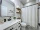 Modern bathroom featuring a sleek vanity, framed mirror and shower with updated fixtures at 3849 Kimbolton Way, Sanford, FL 32773