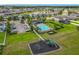 Aerial view of the community playground and pool for residents enjoyment with ample parking nearby at 3849 Kimbolton Way, Sanford, FL 32773