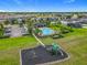 Aerial view of the community playground and pool for residents enjoyment with ample parking nearby at 3849 Kimbolton Way, Sanford, FL 32773