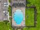 Overhead shot of the community pool with lounge seating, manicured landscaping, and convenient parking spaces at 3849 Kimbolton Way, Sanford, FL 32773