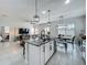 Spacious kitchen island overlooks the living room and dining area, perfect for entertaining and Gathering gatherings at 3849 Kimbolton Way, Sanford, FL 32773