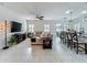 Open-concept living room seamlessly connects to the kitchen and dining area, perfect for modern living at 3849 Kimbolton Way, Sanford, FL 32773