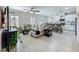 Open-concept living space features tile flooring, a living room, dining area, and a modern kitchen at 3849 Kimbolton Way, Sanford, FL 32773