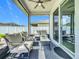 Cozy screened patio featuring a ceiling fan, comfortable seating area, and view of the backyard at 3849 Kimbolton Way, Sanford, FL 32773