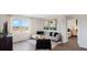 Comfortable living room features contemporary decor, ample natural light, and seamless flow to other areas at 4200 Evernia Rd, Tavares, FL 32778