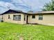 Spacious backyard with green grass, perfect for outdoor activities at 4394 Prince Hall Blvd, Orlando, FL 32811