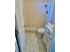 A view of a bathroom with a toilet, shower, and small vanity at 4394 Prince Hall Blvd, Orlando, FL 32811