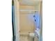 A view of a bathroom with a toilet, shower, and small vanity at 4394 Prince Hall Blvd, Orlando, FL 32811