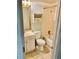 A view of a small bathroom with a toilet, vanity, tub, and framed mirror at 4394 Prince Hall Blvd, Orlando, FL 32811