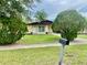 Well-kept home with lush green lawn and mature landscaping at 4394 Prince Hall Blvd, Orlando, FL 32811