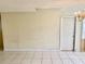 A view of a large living room area with tile floors and a door at 4394 Prince Hall Blvd, Orlando, FL 32811