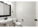 Simple half-bath with pedestal sink, tile flooring, and classic fixtures at 4509 Belkin Ct, Orlando, FL 32814