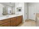 Bathroom with double sink vanity, tile flooring, and a separate tub and shower at 4509 Belkin Ct, Orlando, FL 32814