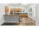 Well-equipped kitchen featuring stainless steel appliances, stylish wood cabinetry, and a functional breakfast bar at 4509 Belkin Ct, Orlando, FL 32814