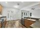 Stylish kitchen with stainless steel appliances, a breakfast bar, and easy access to the outdoors at 4509 Belkin Ct, Orlando, FL 32814