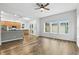 Spacious kitchen with wood cabinets and stainless appliances, seamlessly connected to the open living area at 4509 Belkin Ct, Orlando, FL 32814