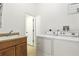 Laundry room featuring a sink, washer, dryer, and extra storage at 4509 Belkin Ct, Orlando, FL 32814