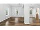 Bright living room featuring wood floors, neutral paint, and large windows that allow for plenty of natural light at 4509 Belkin Ct, Orlando, FL 32814
