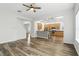 Open-concept floorplan features modern wood floors, seamlessly connecting living and kitchen spaces at 4509 Belkin Ct, Orlando, FL 32814