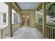 Covered porch with railing, double doors, and plenty of space to relax at 4509 Belkin Ct, Orlando, FL 32814