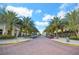 A picturesque street lined with palm trees on the side of the street and commercial buildings, adding a tropical flair to the neighborhood at 4509 Belkin Ct, Orlando, FL 32814
