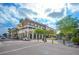 Commercial district with mixed-use buildings, sidewalks, and street parking, blending retail and residential spaces in a vibrant setting at 4509 Belkin Ct, Orlando, FL 32814