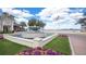Attractive water fountain with colorful flowers, offering a tranquil outdoor space for relaxation and enjoyment in a picturesque community at 4509 Belkin Ct, Orlando, FL 32814