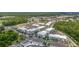 Aerial view showcasing modern apartments with ample parking, landscaped surroundings, and easy access to amenities at 452 Diamond Dove Cv, Winter Springs, FL 32708