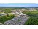 Expansive aerial view showcasing a new community surrounded by lush greenery and serene landscapes at 452 Diamond Dove Cv, Winter Springs, FL 32708